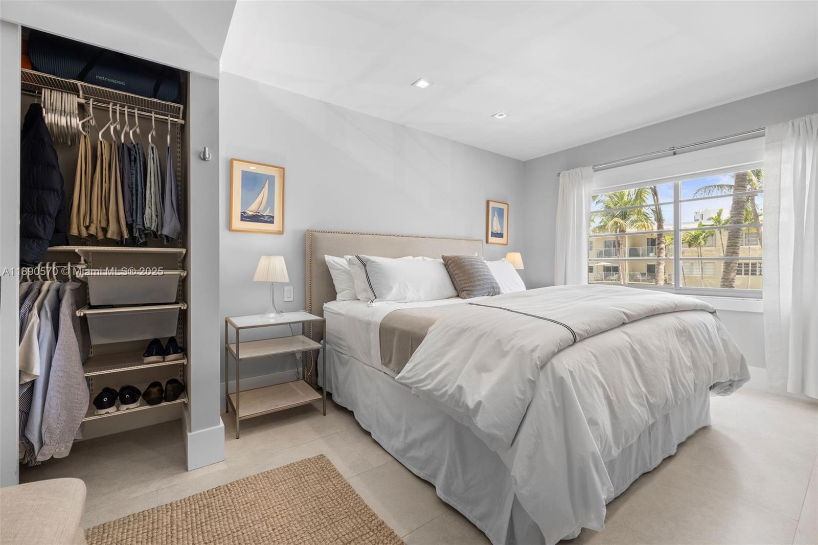 1450 Lincoln Road, Unit 304 Miami Beach, FL 33139 - Photo 22 of 35 a bedroom with a bed and a window