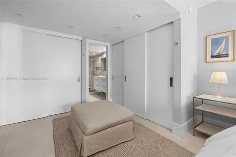 a room with a bed and a view of bathroom