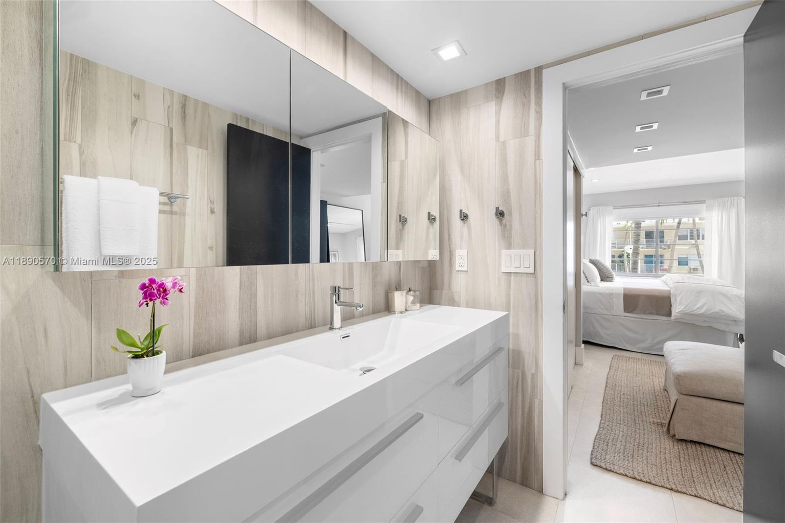 1450 Lincoln Road, Unit 304 Miami Beach, FL 33139 - Photo 26 of 35 a en suite bathroom with a granite countertop tub and a sink