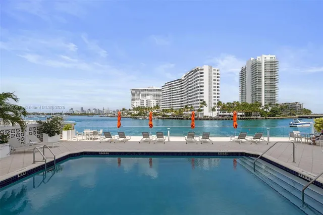a view of a lake with tall building