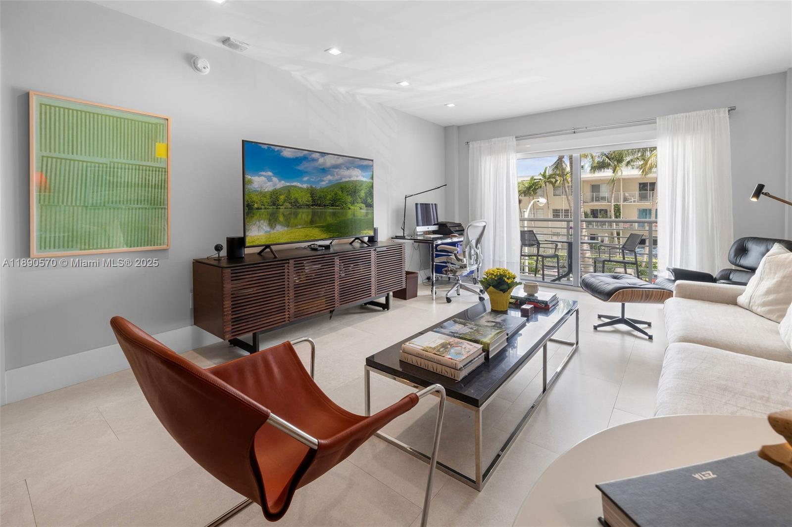 1450 Lincoln Road, Unit 304 Miami Beach, FL 33139 - Photo 5 of 35 a living room with furniture and a flat screen tv