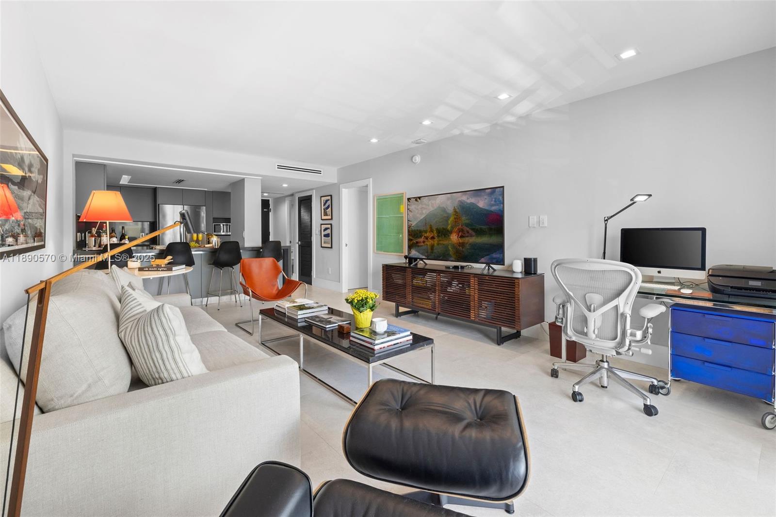 1450 Lincoln Road, Unit 304 Miami Beach, FL 33139 - Photo 7 of 35 a living room with furniture and a flat screen tv