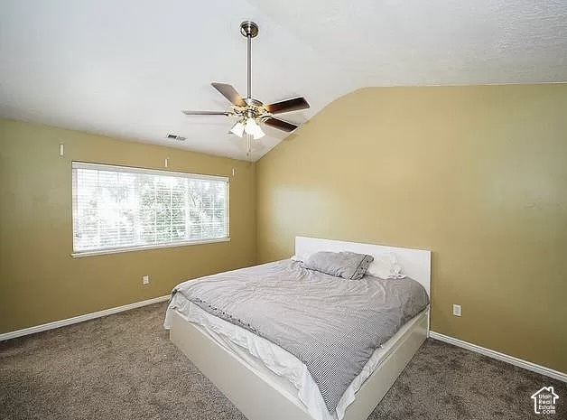 13548 South Villa Rosa Way Draper, UT 84020 - Photo 13 of 28 Sloped ceiling room featuring a ceiling fan with integrated lighting, a wide window with blinds, and carpet flooring