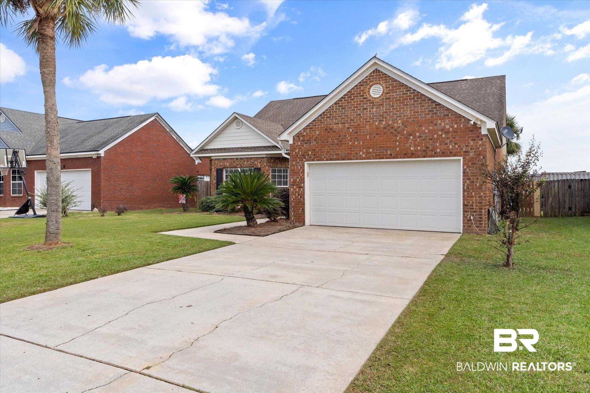 3876 Emerille Drive Foley, AL 36535 - Photo 30 of 31 View of front of home with a front yard and a garage