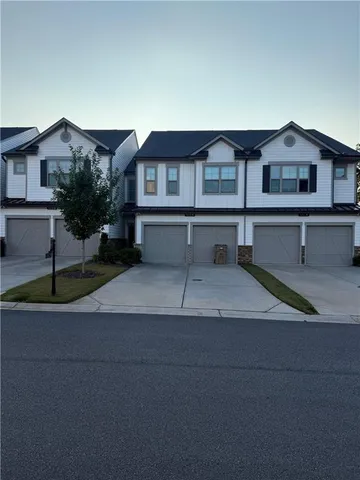 a view of a house with a street