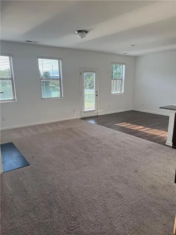 a view of an empty room with windows