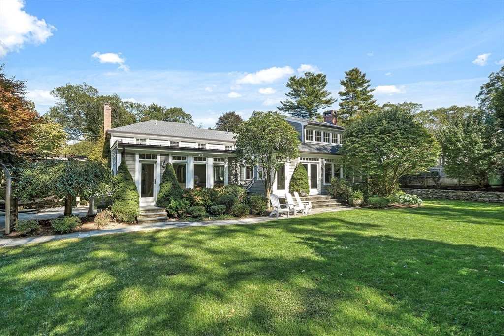 27 Radcliffe Road Wellesley, MA 02482 - Photo 36 of 38 a front view of a house with a yard