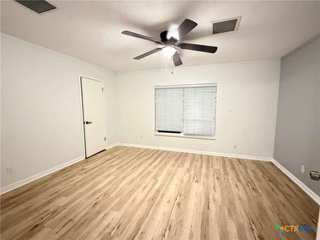 425 Woodland Point Road Belton, TX 76513 - Photo 17 of 27 a view of an empty room with a window
