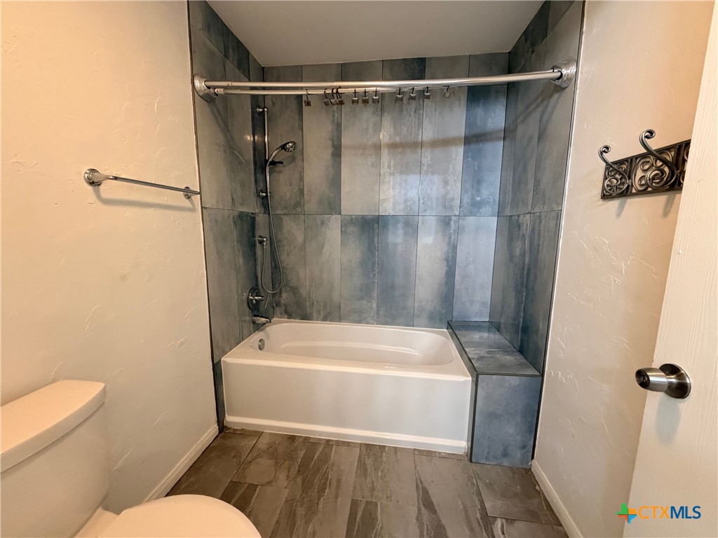 425 Woodland Point Road Belton, TX 76513 - Photo 18 of 27 a bathroom with a sink toilet and shower