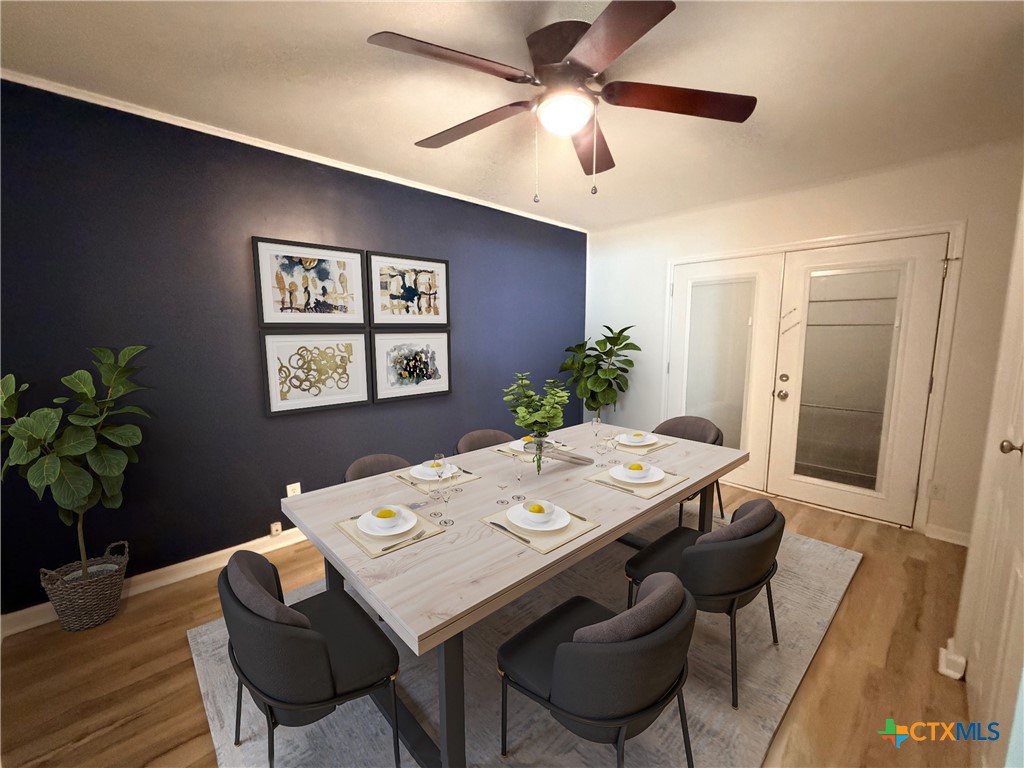 425 Woodland Point Road Belton, TX 76513 - Photo 21 of 27 a view of a dining room with furniture and wooden floor