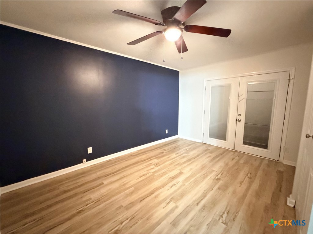 425 Woodland Point Road Belton, TX 76513 - Photo 22 of 27 a view of empty room with wooden floor
