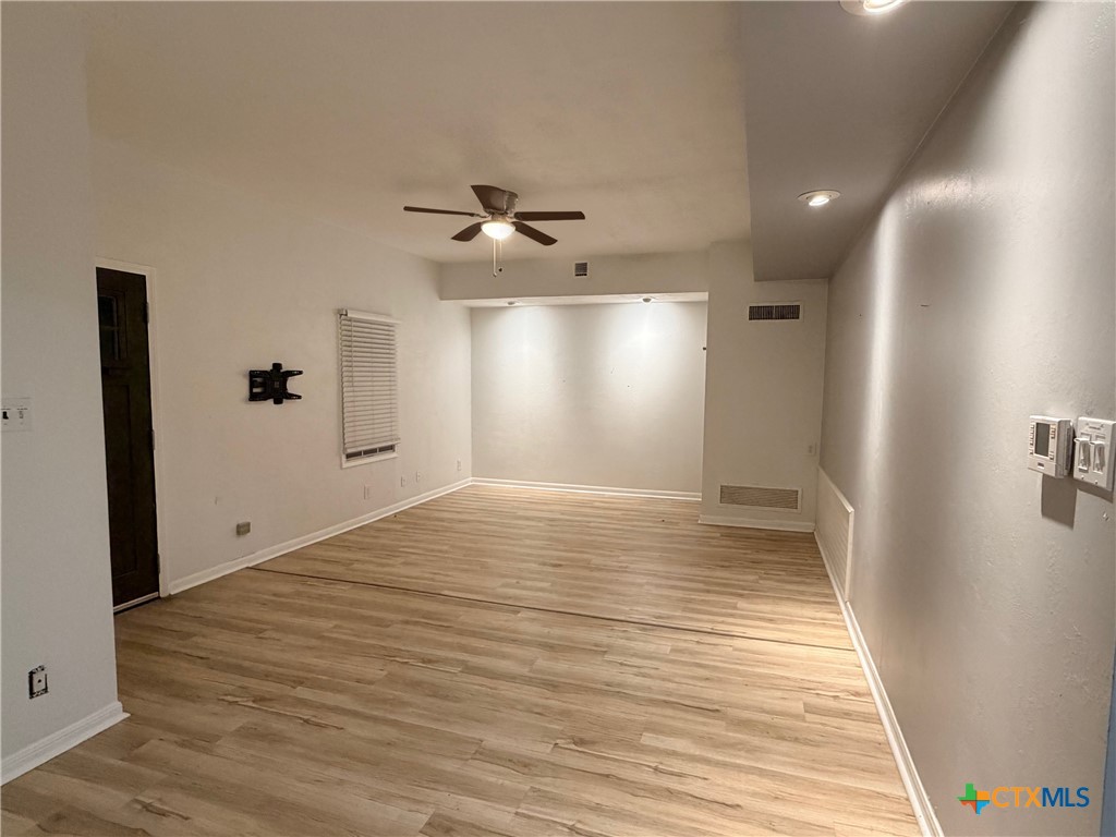 425 Woodland Point Road Belton, TX 76513 - Photo 9 of 27 a view of empty room with wooden floor
