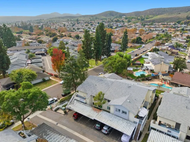 an aerial view of a house with a yard