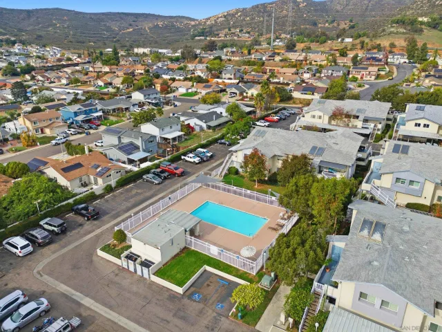 an aerial view of residential houses with outdoor space