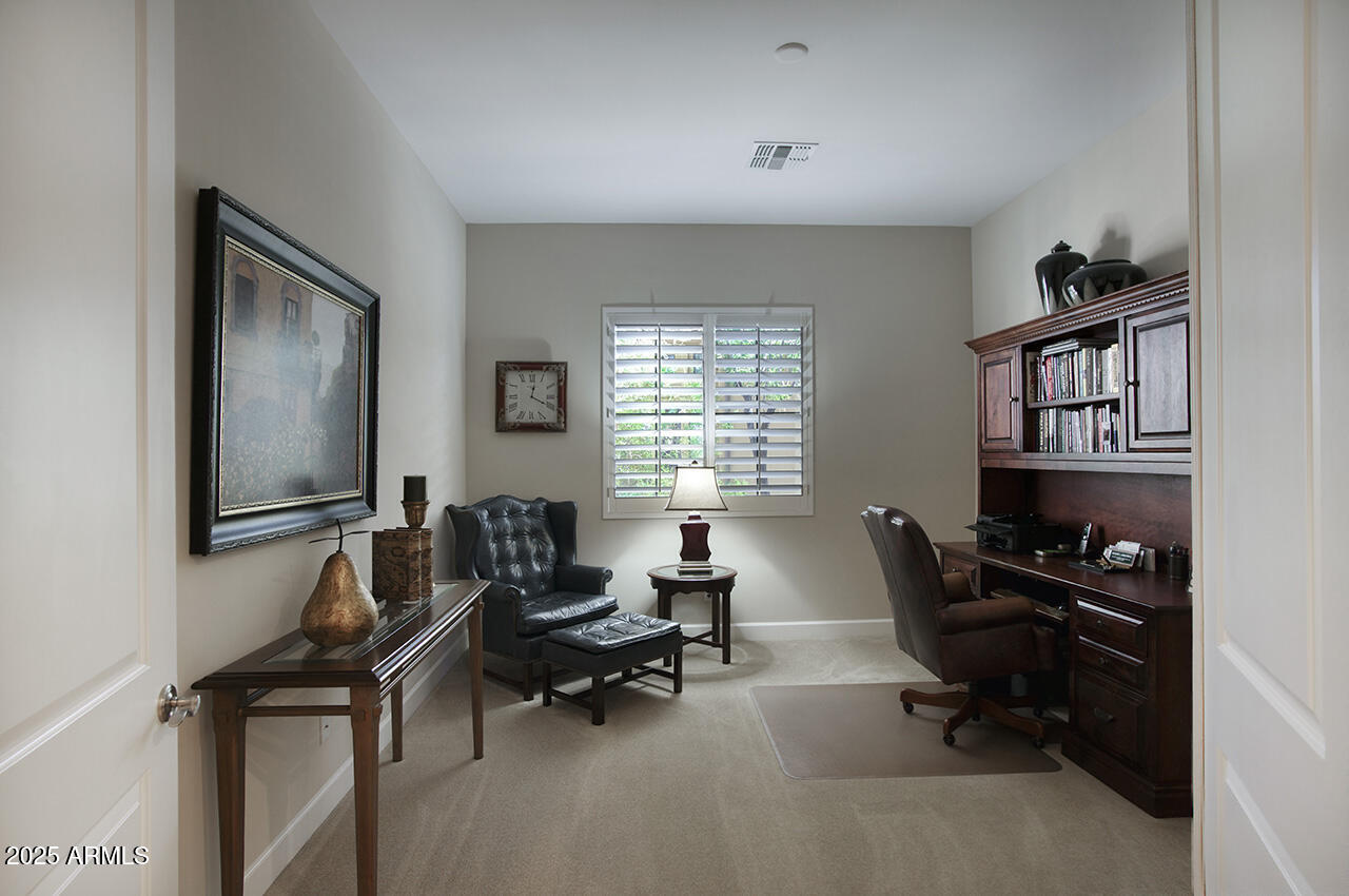9190 East Hoverland Road Scottsdale, AZ 85255 - Photo 18 of 35 a livingroom with workspace and a window