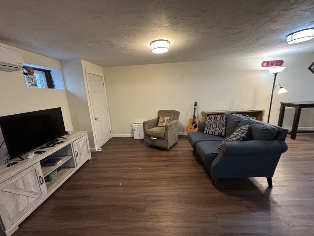 77 Branch Road East Bridgewater, MA 02333 - Photo 12 of 16 a living room with furniture and a flat screen tv