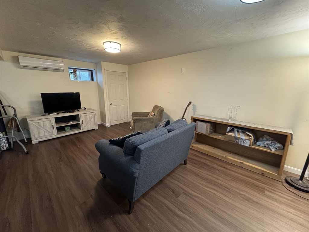 77 Branch Road East Bridgewater, MA 02333 - Photo 14 of 16 a living room with furniture and a flat screen tv