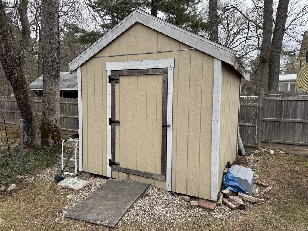 77 Branch Road East Bridgewater, MA 02333 - Photo 6 of 16 a front view of a house with a yard