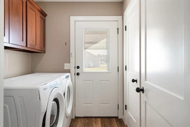 a view of storage and utility room with washer and dryer