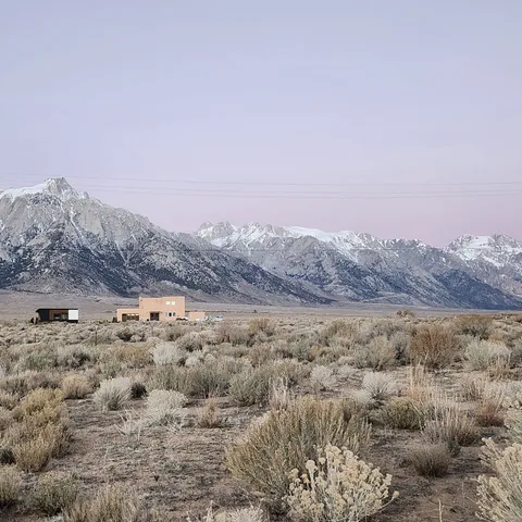a view of a mountain view with mountains in the background
