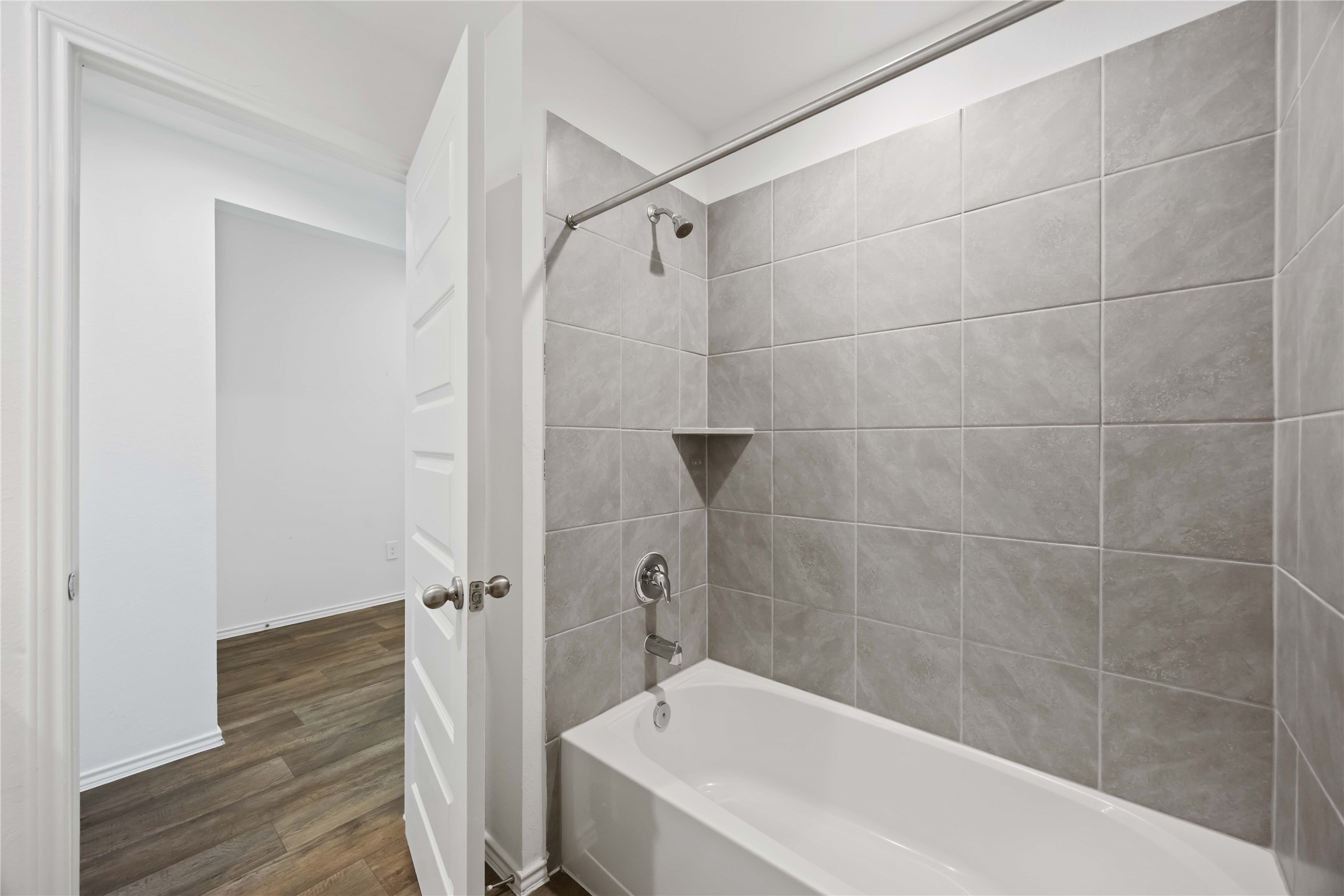 3719 Lanercost Lane Fulshear, TX 77441 - Photo 19 of 43 a bathroom with a bathtub and a shower