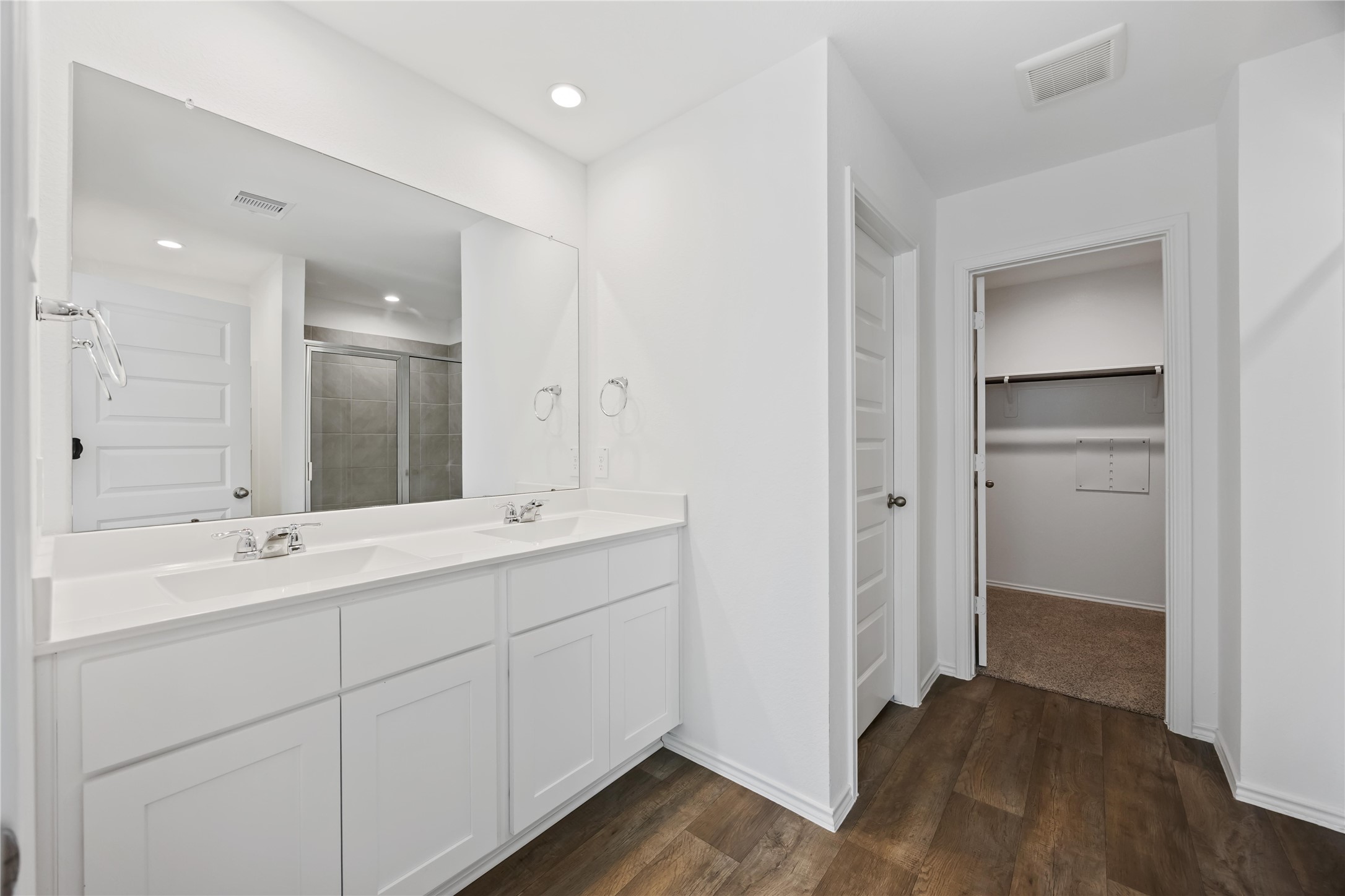 3719 Lanercost Lane Fulshear, TX 77441 - Photo 28 of 43 a bathroom with a double vanity sink and mirror