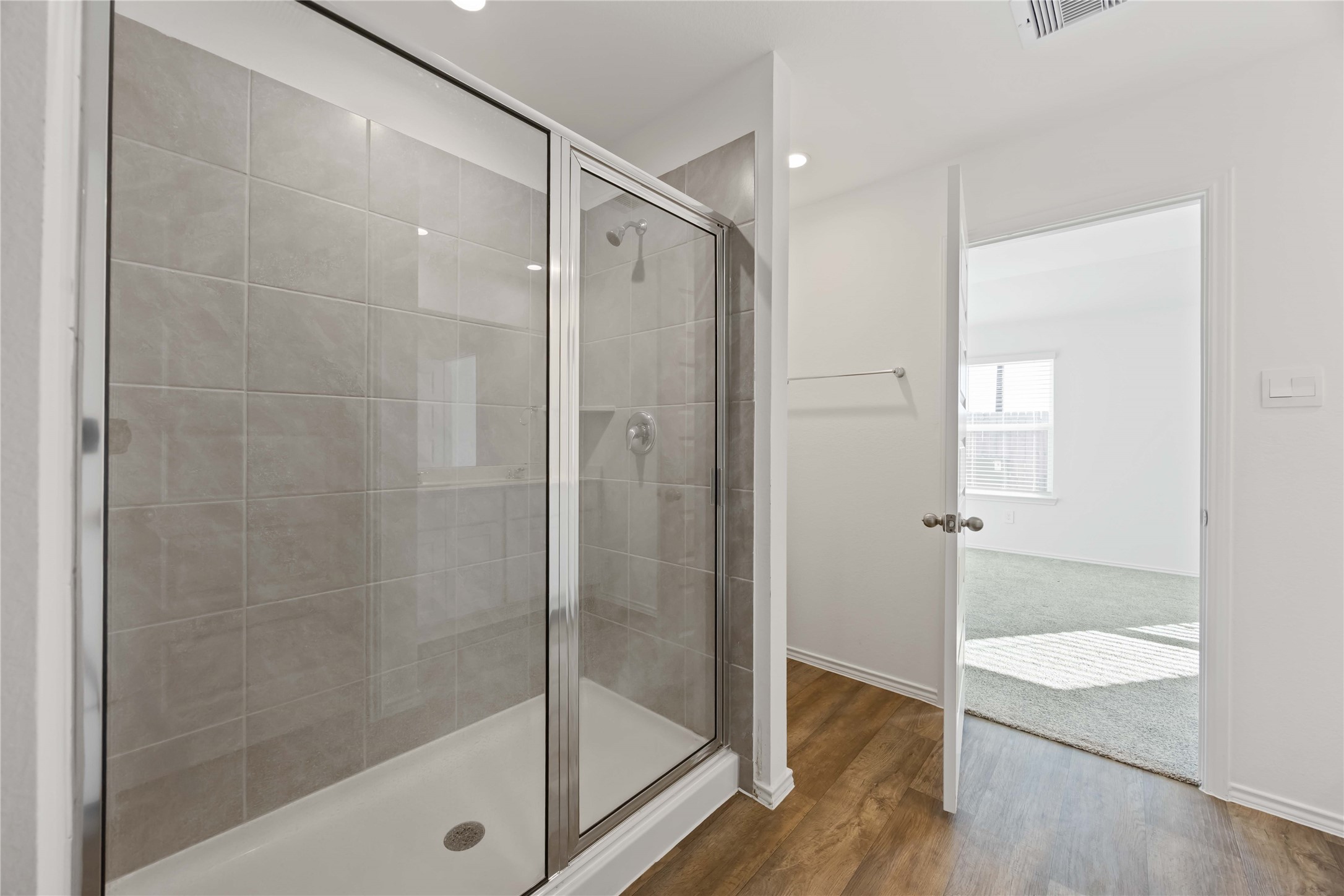 3719 Lanercost Lane Fulshear, TX 77441 - Photo 30 of 43 a bathroom with a shower and a glass door