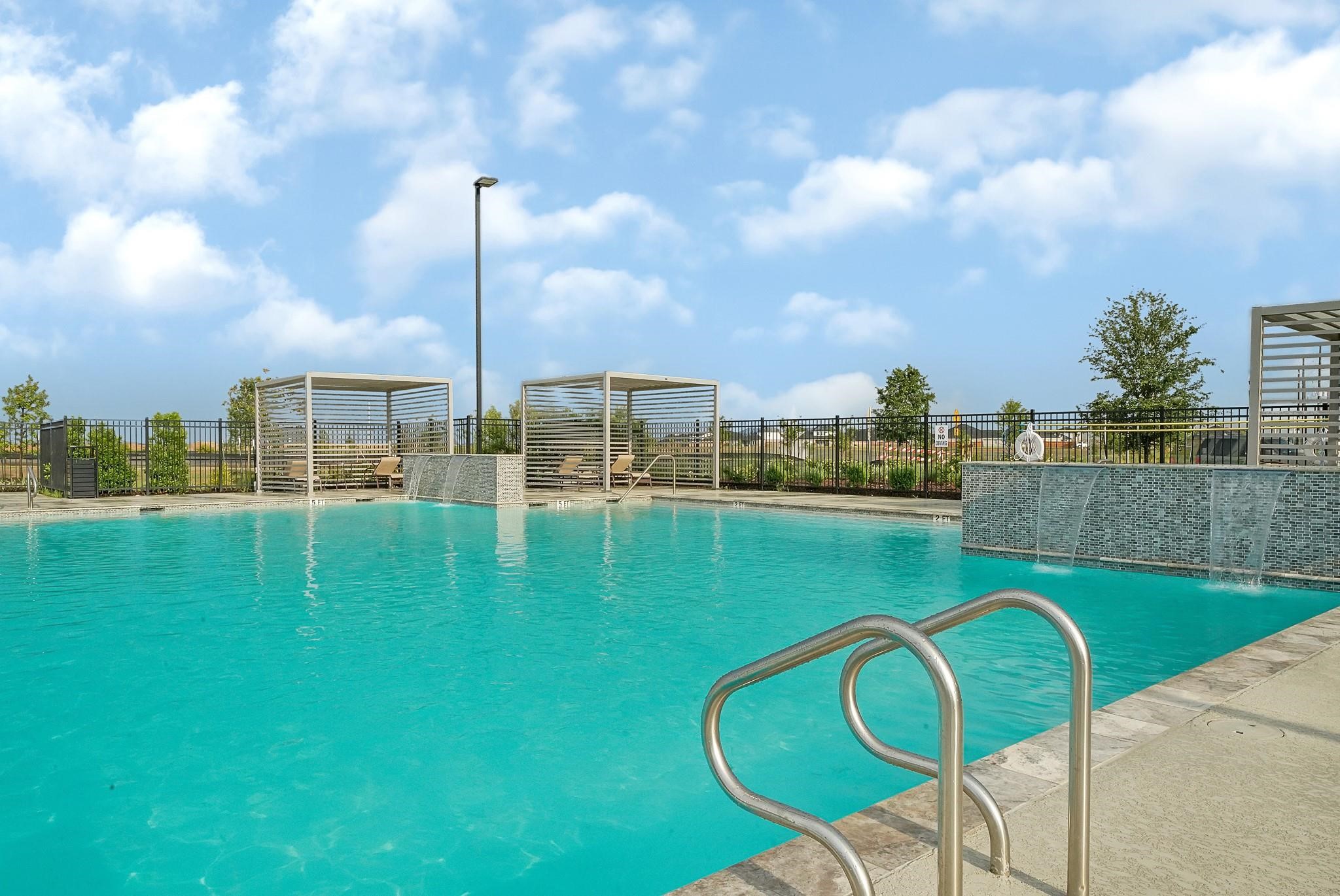 3719 Lanercost Lane Fulshear, TX 77441 - Photo 42 of 43 a view of a swimming pool and a chairs