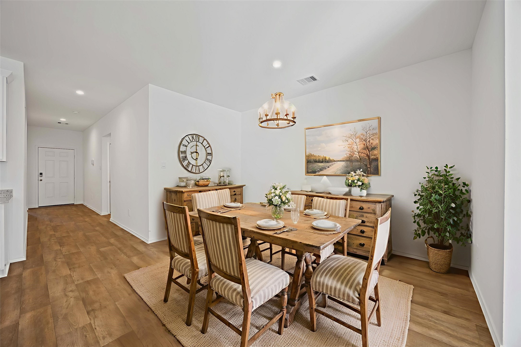 3719 Lanercost Lane Fulshear, TX 77441 - Photo 5 of 43 a view of a dining room with furniture and chandelier