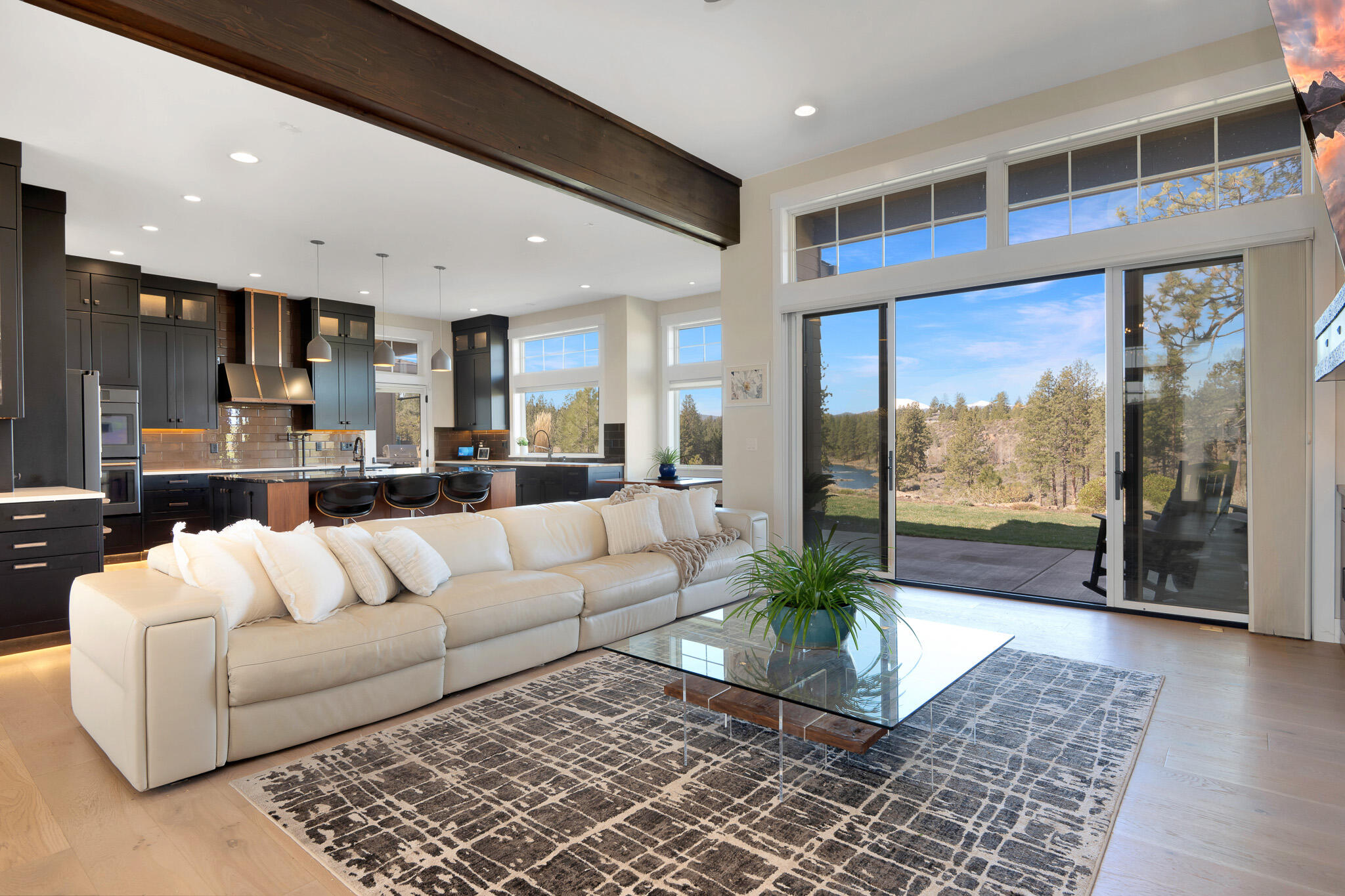 60871 River Rim Drive Bend, OR 97702 - Photo 8 of 42 a living room with furniture and a large window