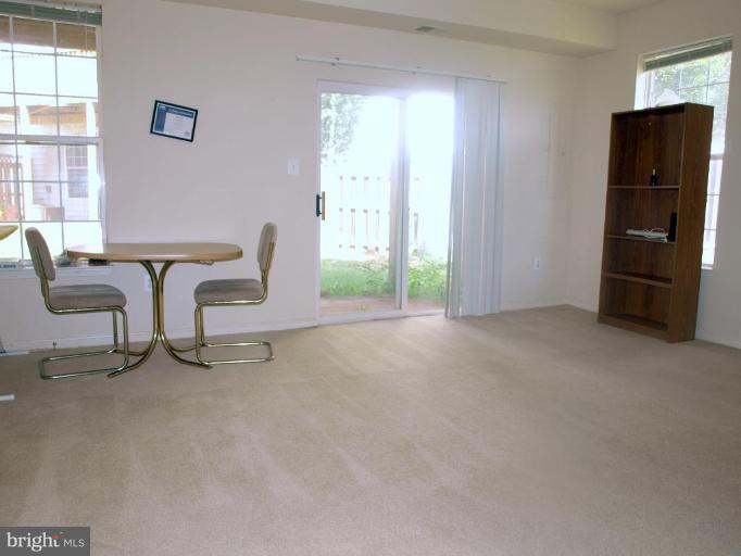 46182 Chester Terrace Sterling, VA 20165 - Photo 2 of 25 a view of a livingroom with furniture and windows