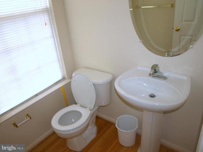 46182 Chester Terrace Sterling, VA 20165 - Photo 20 of 25 a bathroom with a toilet and a sink