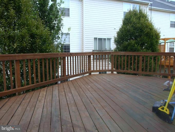 46182 Chester Terrace Sterling, VA 20165 - Photo 22 of 25 a balcony with wooden floor