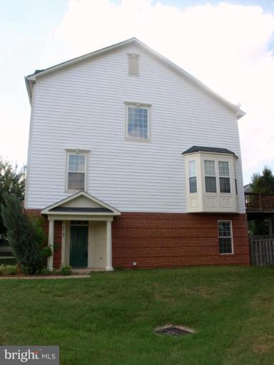 46182 Chester Terrace Sterling, VA 20165 - Photo 24 of 25 a front view of a house with a garden