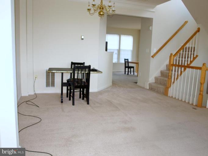 46182 Chester Terrace Sterling, VA 20165 - Photo 7 of 25 a view of a livingroom with furniture and stairs