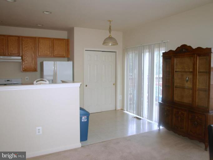 46182 Chester Terrace Sterling, VA 20165 - Photo 10 of 25 a view of a kitchen with refrigerator and cabinet