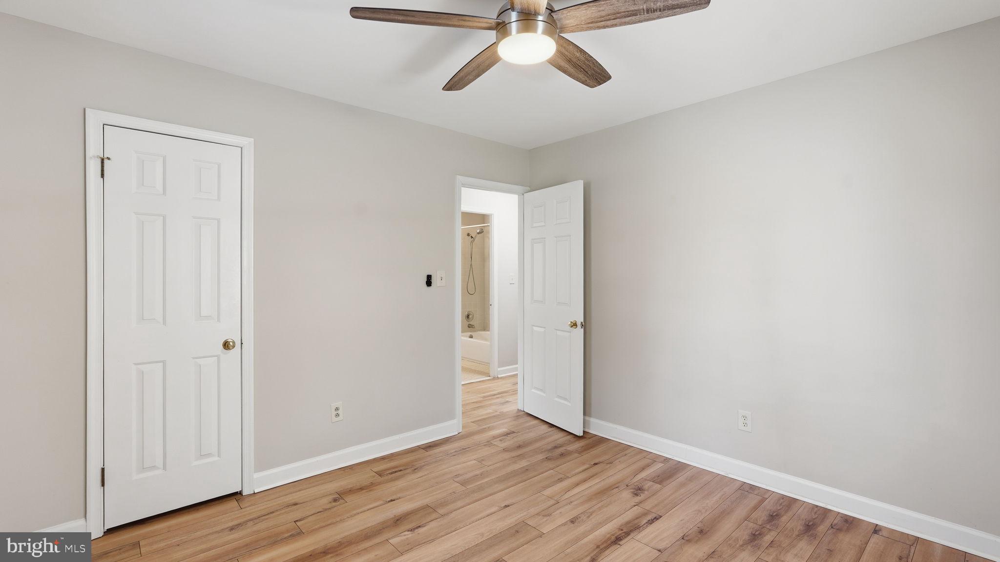 6499 Briggs Road Warrenton, VA 20187 - Photo 19 of 29 a view of a room with wooden floor and white walls