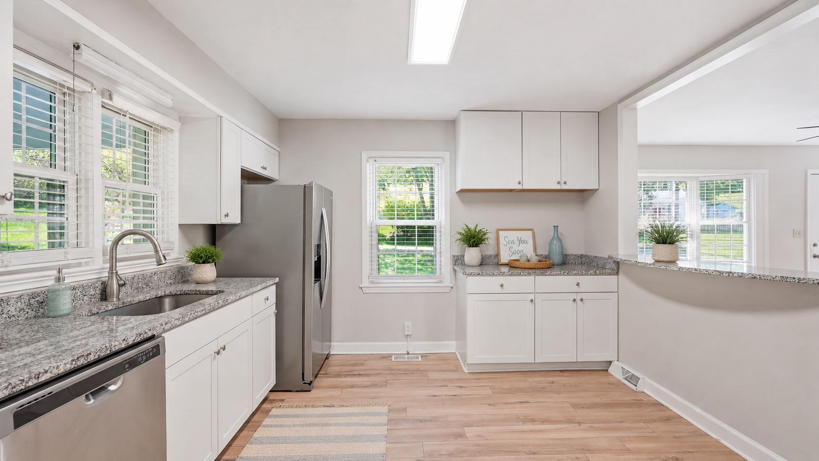 6499 Briggs Road Warrenton, VA 20187 - Photo 6 of 29 a kitchen with granite countertop a sink stove and refrigerator