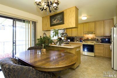 5160 Sharp Road Calistoga, CA 94515 - Photo 4 of 9 a kitchen with a stove a sink and cabinets