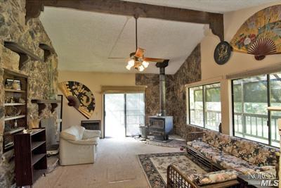 5160 Sharp Road Calistoga, CA 94515 - Photo 5 of 9 a living room with furniture and a large window