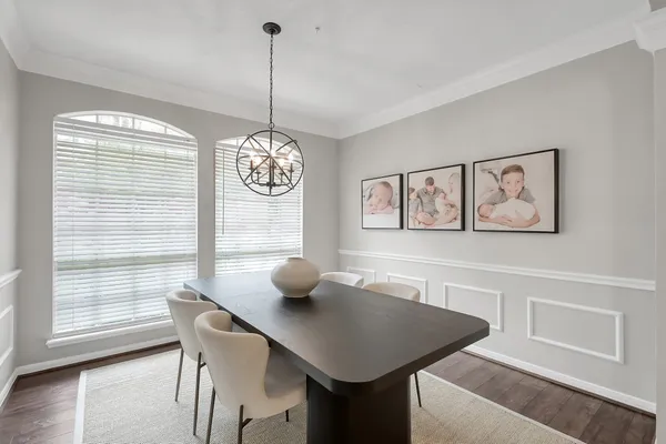a view of a dining room with furniture and wooden floor