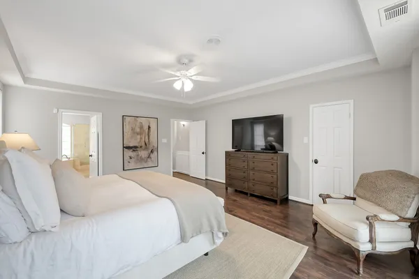 a bedroom with a bed and a couch