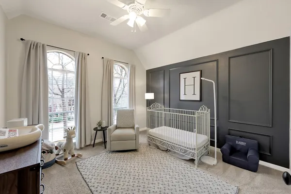 a bedroom with furniture and a window