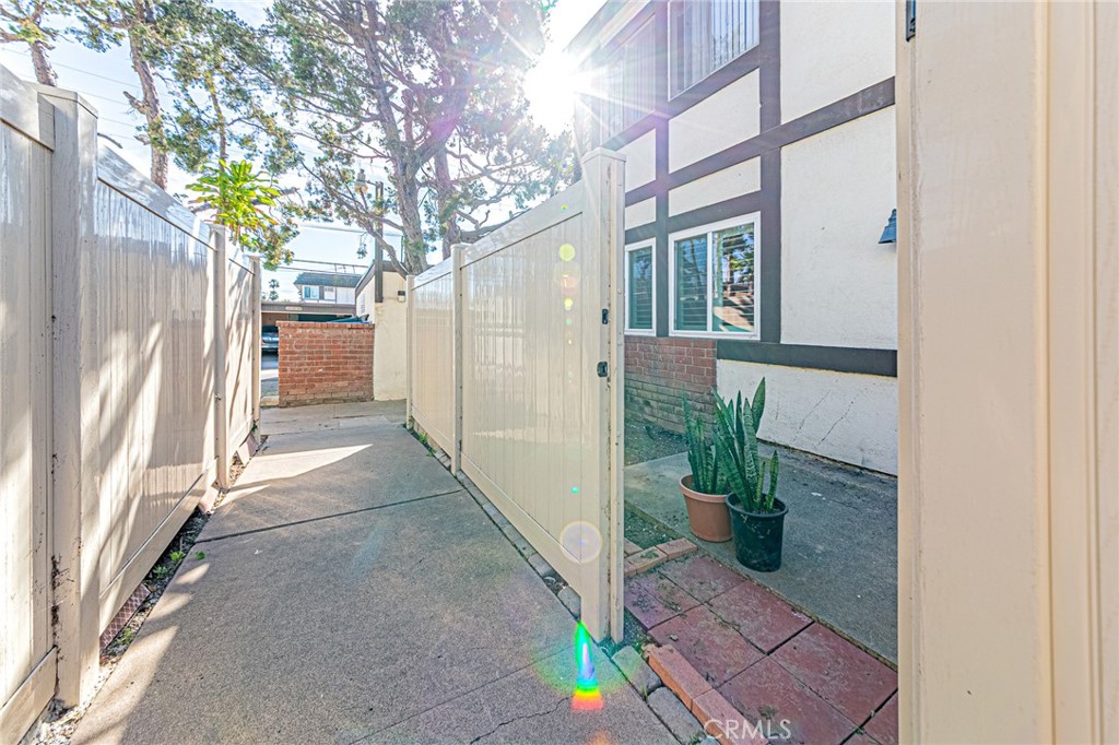 15510 Williams Street, Unit F Tustin, CA 92780 - Photo 25 of 34 Walkway to garage
