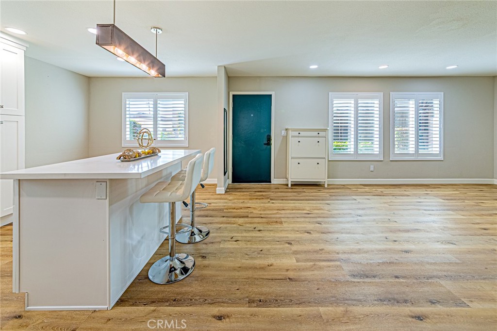 15510 Williams Street, Unit F Tustin, CA 92780 - Photo 6 of 34 Wood flooring throughout the home