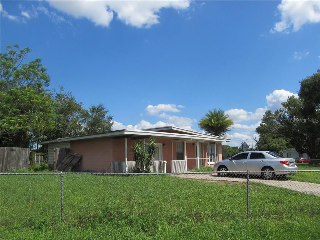 119 Azalea Lane Sanford, FL 32773 - Photo 1 of 1 a front view of a house with a garden