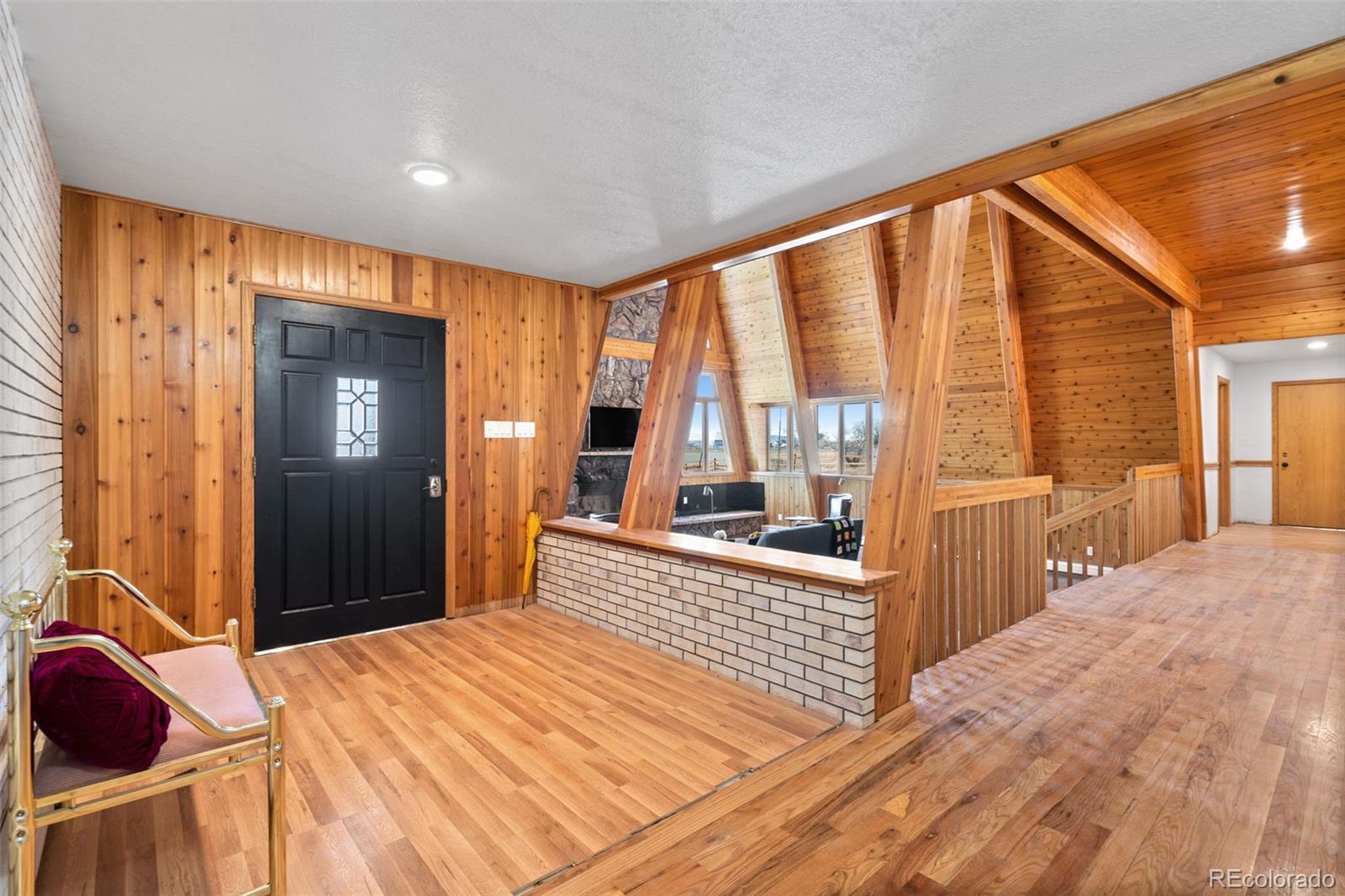 13231 Dillon Street Brighton, CO 80601 - Photo 2 of 49 a bedroom with a bed and large windows