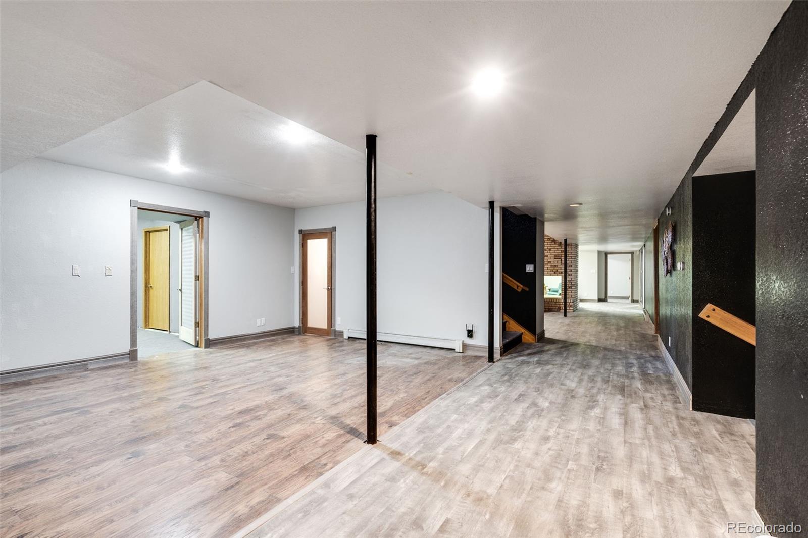 13231 Dillon Street Brighton, CO 80601 - Photo 29 of 49 a view of empty room with wooden floor