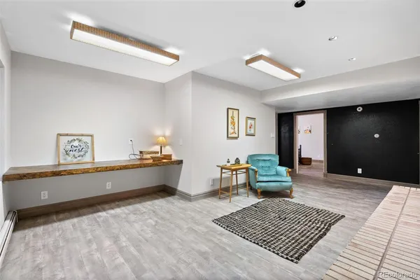 a spacious bedroom with a bed and a window