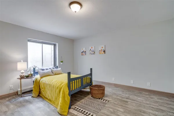 a bedroom with bed and a window